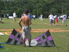 Peter taking a break... flying his tiny miniature kite (is it in the photo or not??)